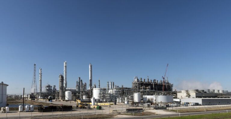 Oil refinery towers and piping in Groves, Texas